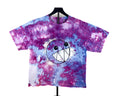 A short-sleeve tie-dye t-shirt on a black hanger, featuring a purple, pink, and blue watercolor pattern with a central cartoon smiley face graphic.