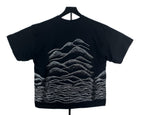 A black short-sleeve t-shirt with layered soundwave-style hills.