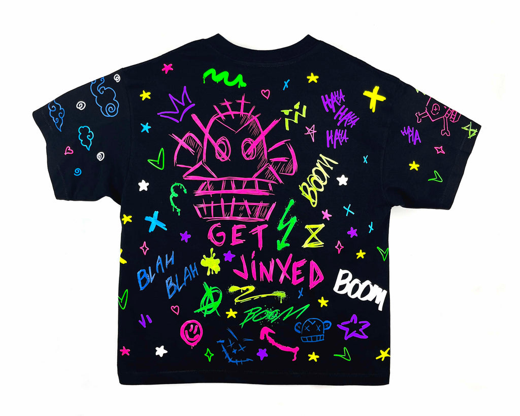 Black t-shirt with colorful graphics and text on a white background