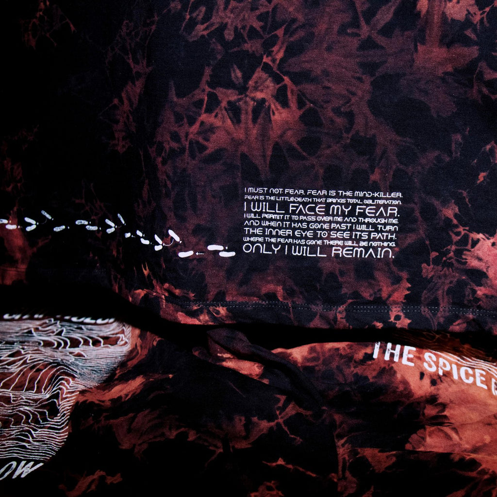 Tie-dye hoodie with text on a dark background