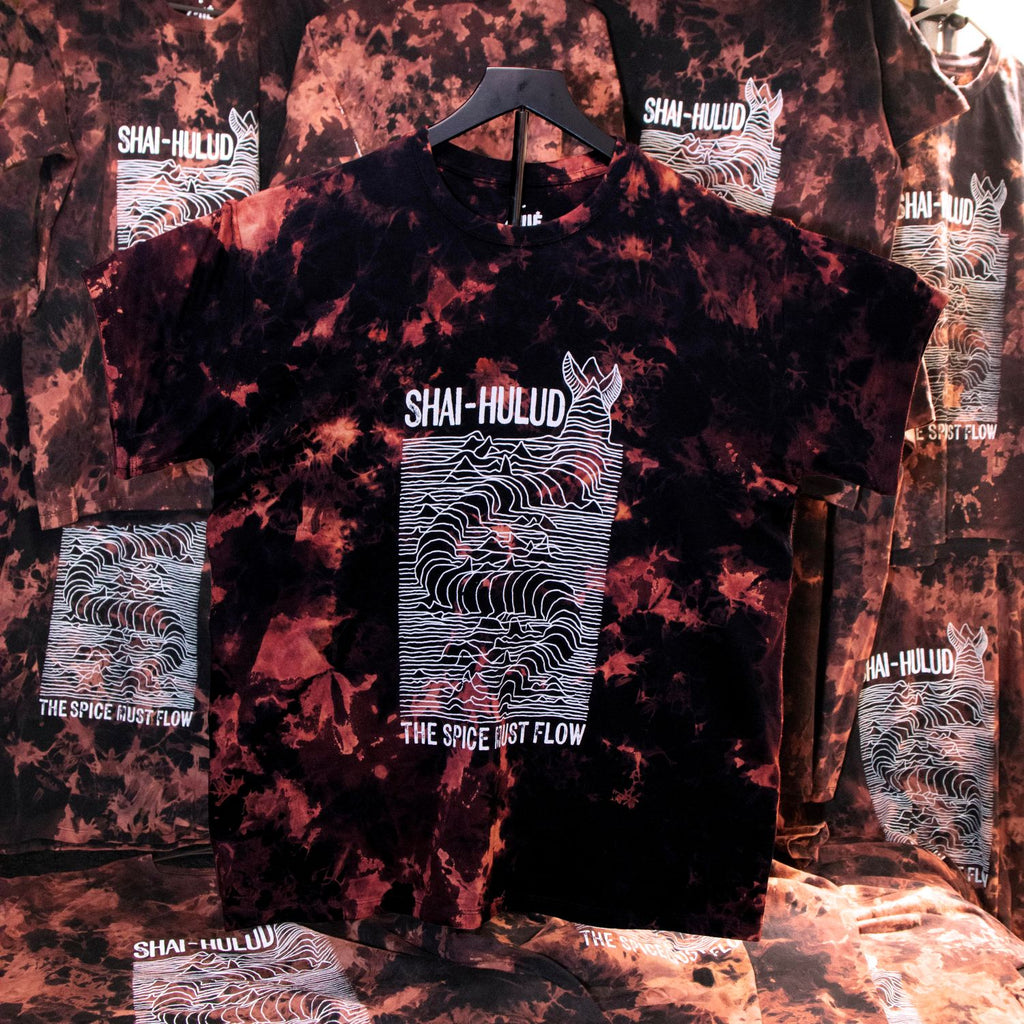 Tie-dye t-shirt with 'Shai-Hulud' design on a textured background