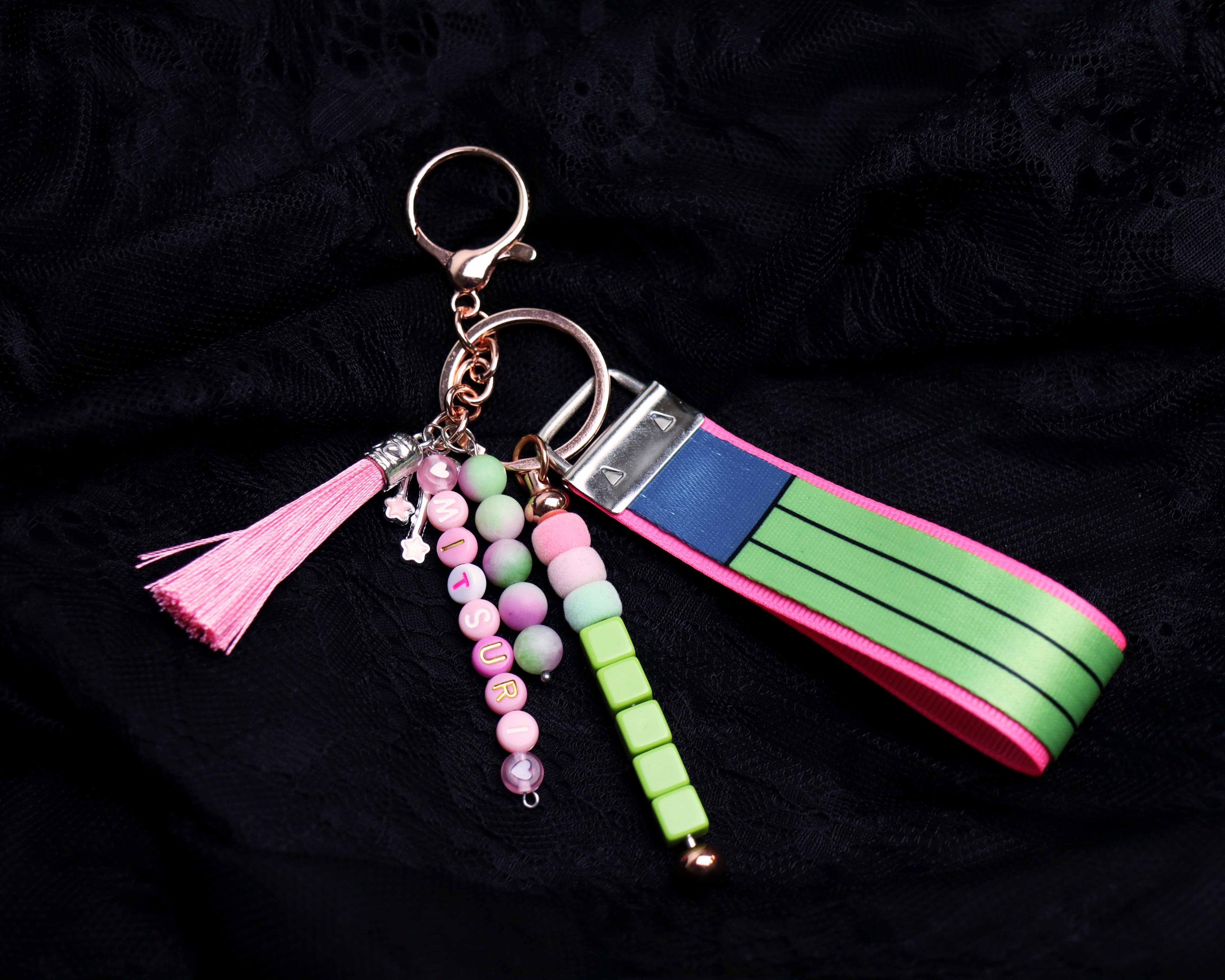 Keychain with colorful beads and tassel on a black background
