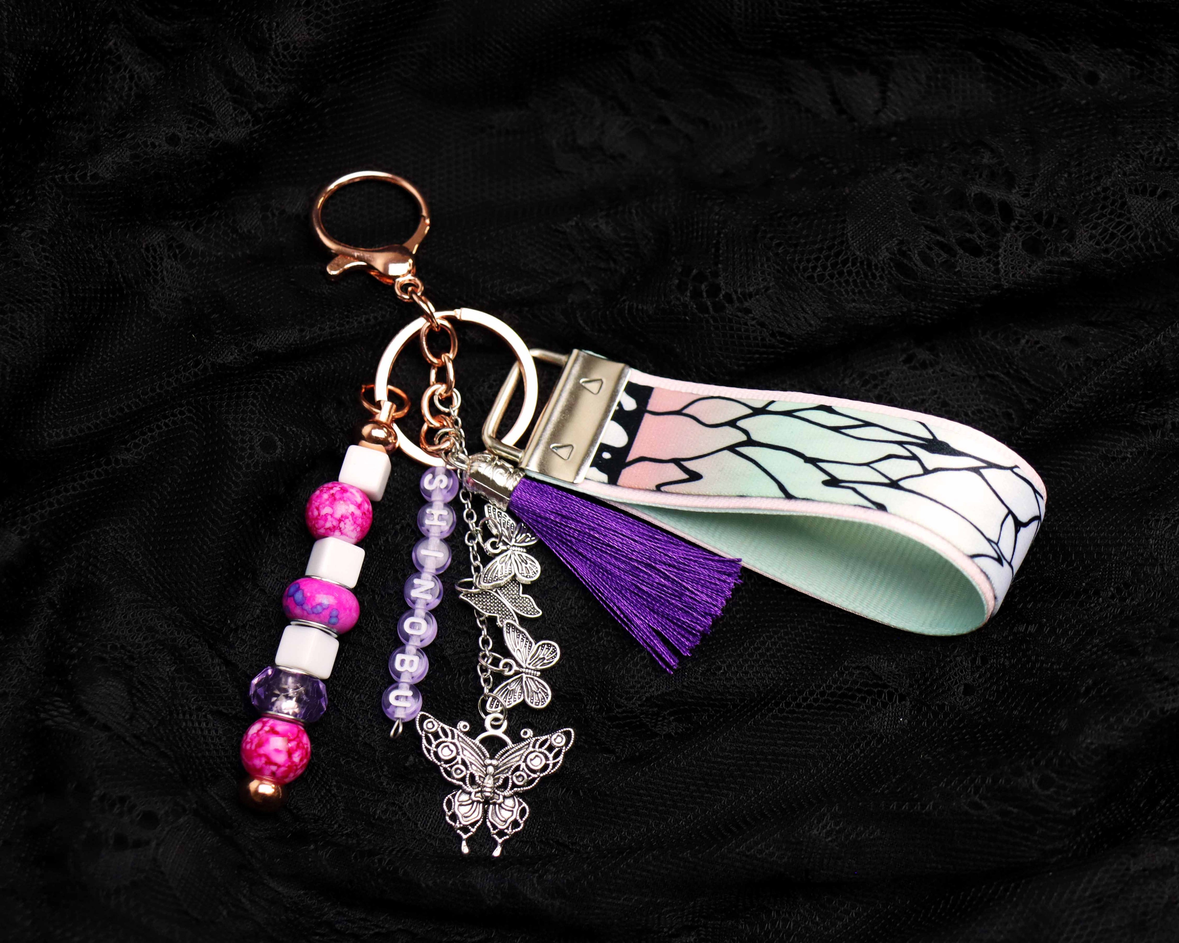 Keychain with beads, tassel, and decorative elements on a dark background
